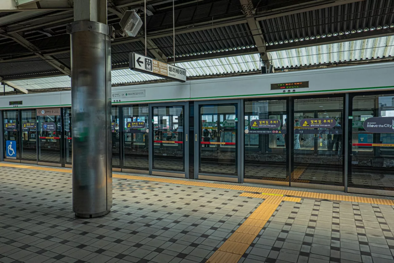 a train station with a train parked next to it